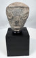 Mesopotamian pottery fragment with geometric facial features and angular brows