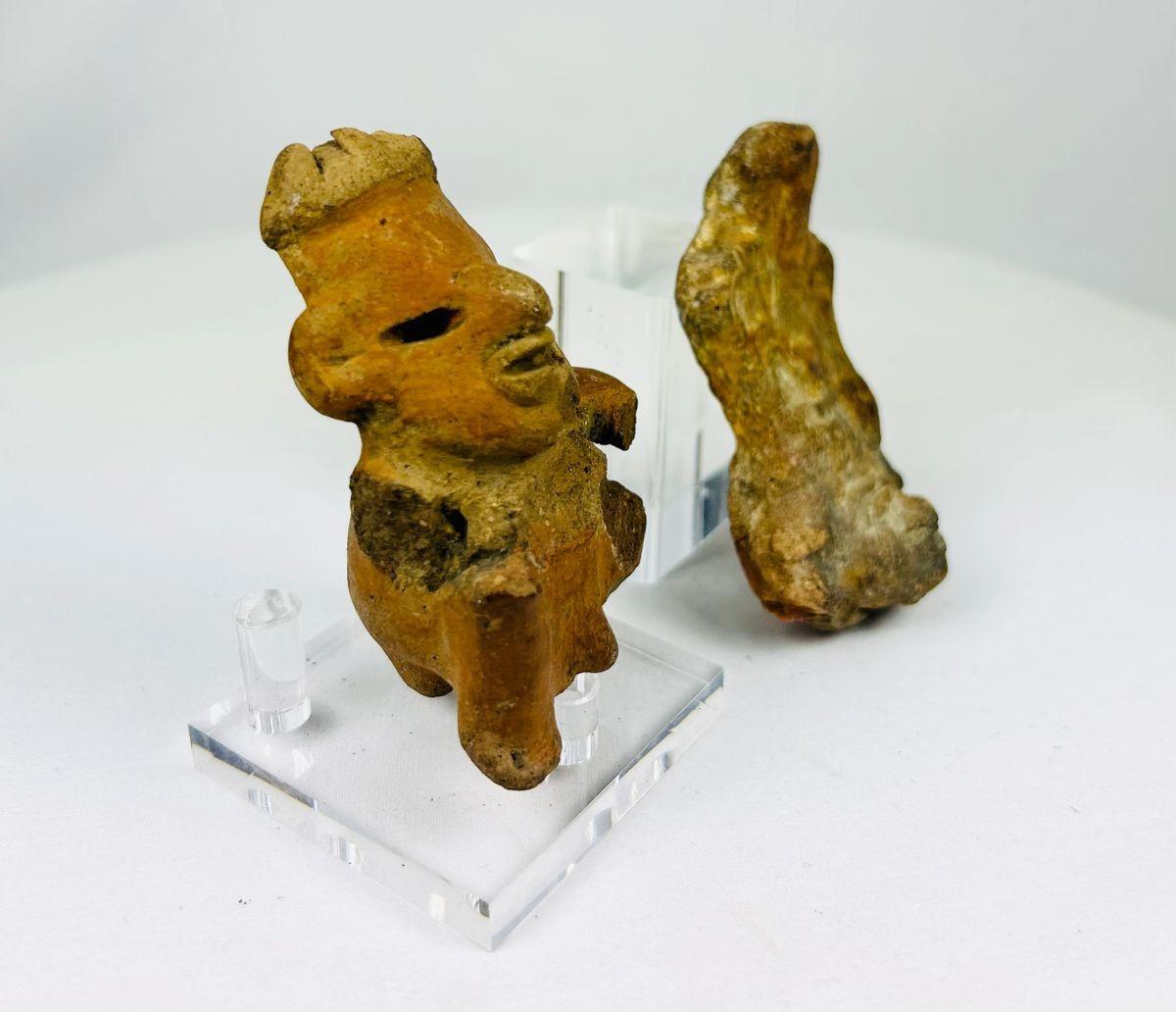 Pair of ancient Mexican pottery figures from Jalisco and Nayarit, circa 200 BCE, depicting human forms with stylized facial features and fragmented bodies, reddish terracotta with natural surface wear and encrustation, characteristic of West Mexican shaft tomb culture artifacts.