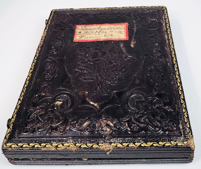 Embossed Victorian photographic case retaining handwritten family label and decorative gilt border