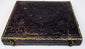 Antique photographic case with ornate embossed exterior, gilt border detailing, and metal closure hardware