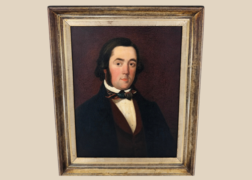 Early Victorian British oil portrait of a gentleman in a dark frock coat and patterned cravat
