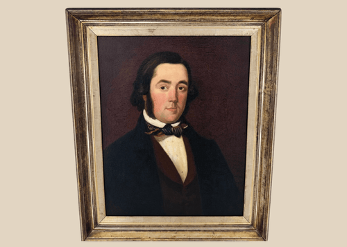 Early Victorian British oil portrait of a gentleman in a dark frock coat and patterned cravat