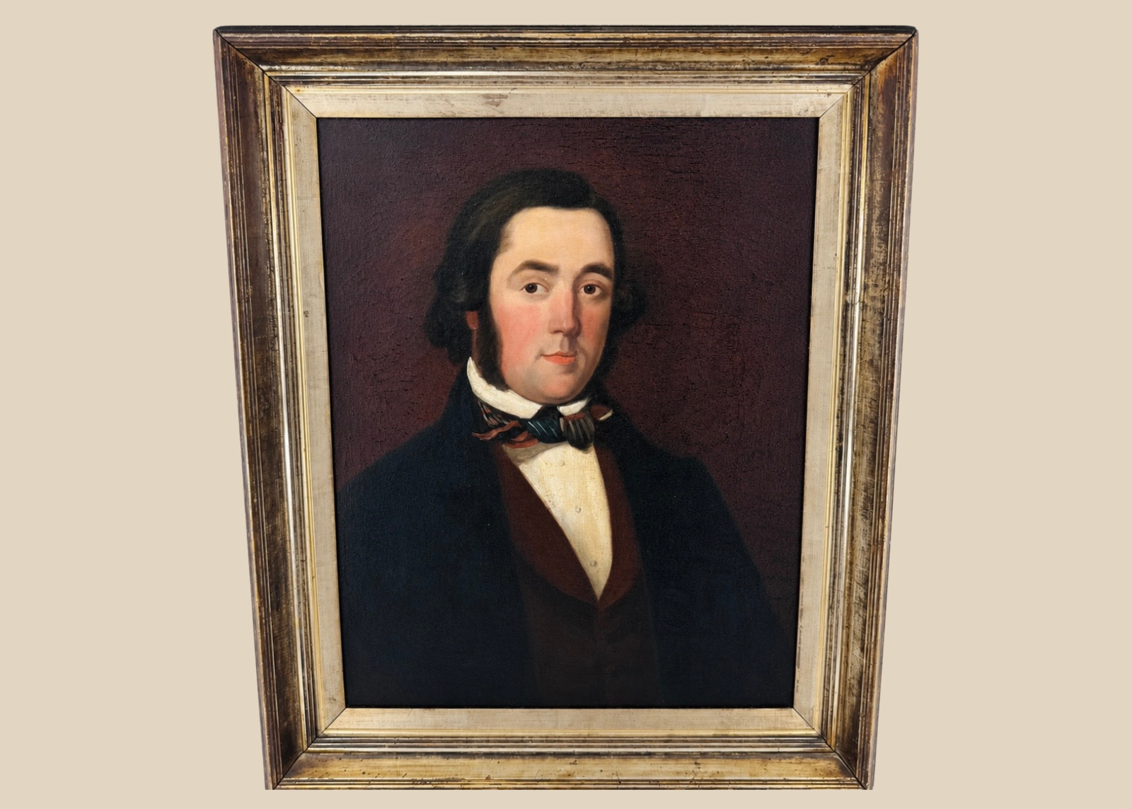 Early Victorian British oil portrait of a gentleman in a dark frock coat and patterned cravat
