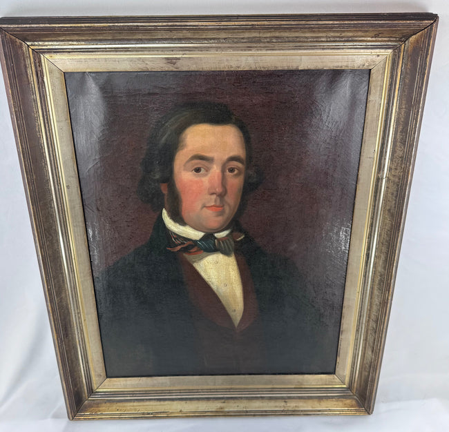 Framed Victorian male portrait with a deep burgundy-brown background and giltwood frame