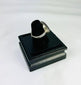 Oval red carnelian intaglio ring from Ancient Near East, 1st millennium BCE, detailed engravings, displayed on black stand