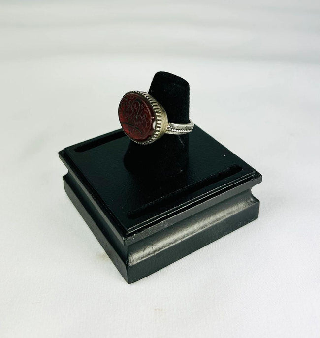 1st millennium BCE carnelian intaglio ring, Ancient Near East, silver bezel, finely detailed animal and symbolic carvings