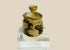 Ancient Roman or Parthian glass cosmetic jar, circa 2nd–3rd century CE, with rounded body, fitted lid topped by a knob finial, and luminous iridescent patina developed over centuries.