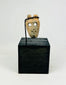 Pre-Columbian bone mask pendant with hollowed eyes and open mouth, ritual funerary object