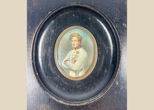 Finely painted mid–late 19th-century miniature portrait of Napoleon II, Duke of Reichstadt, in Austrian white dress uniform with red collar and blue sash, gouache on wafer under glass, set in original ebonized wood frame with brass bezel, Central Europe, circa 1860–1885