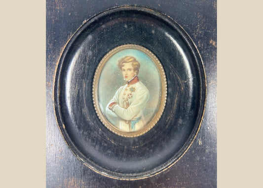 Finely painted mid–late 19th-century miniature portrait of Napoleon II, Duke of Reichstadt, in Austrian white dress uniform with red collar and blue sash, gouache on wafer under glass, set in original ebonized wood frame with brass bezel, Central Europe, circa 1860–1885