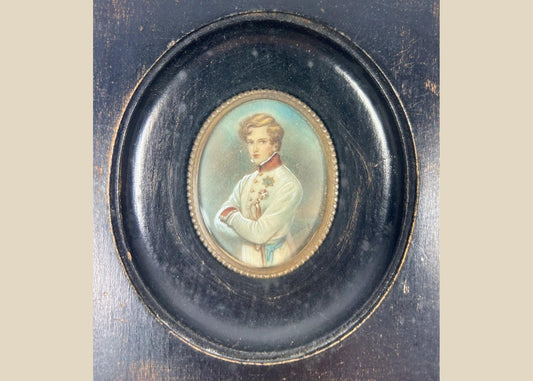 Finely painted mid–late 19th-century miniature portrait of Napoleon II, Duke of Reichstadt, in Austrian white dress uniform with red collar and blue sash, gouache on wafer under glass, set in original ebonized wood frame with brass bezel, Central Europe, circa 1860–1885