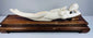Monumental mid-20th-century Chinese reclining female figure displayed on a custom-carved dark hardwood pedestal