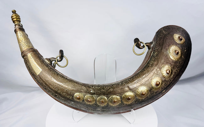 North African copper-alloy powder flask with ten raised floral bosses