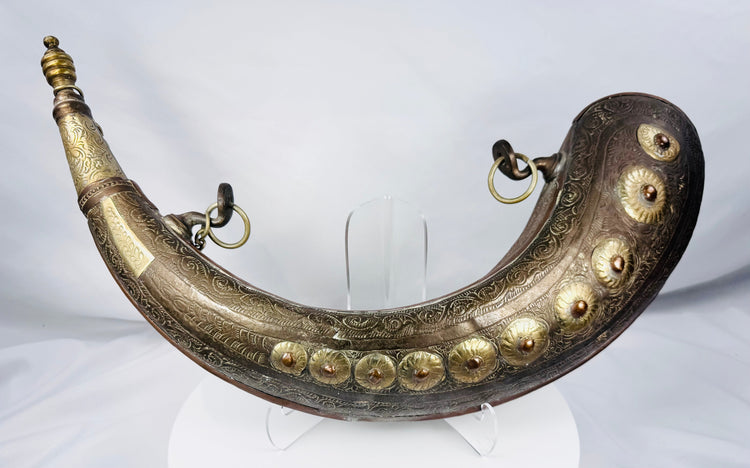 North African copper-alloy powder flask with ten raised floral bosses