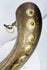 North African crescent powder flask with embossed flower bosses and aged patina