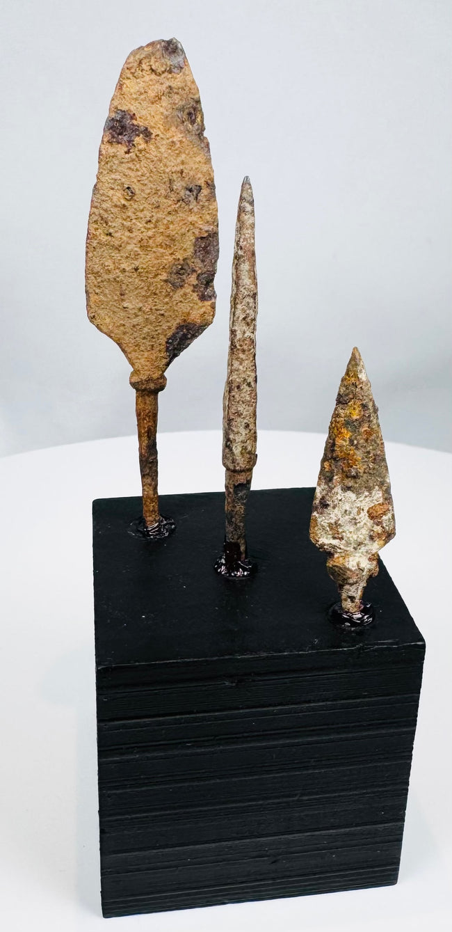 Broad leaf-shaped iron arrowhead with surviving tang and archaeological corrosion