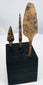 Three hand-forged European iron arrowheads in broad, bodkin, and triangular forms