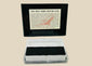 Authentic NASA Space Shuttle HRSI tile from the 1980s, silica-based ceramic with black Reaction Cured Glass (RCG) coating, designed for high-temperature reentry, displayed in original NASA-issued case with documentation.