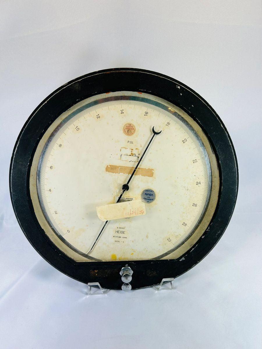 Authentic NASA low-pressure gauge from the Space Shuttle Program, mid-1980s. Manufactured by Heise in Newtown, Connecticut, marked “Property of NASA U.S. Government,” with original calibration and service stickers. Ground support equipment used for monitoring hydraulic, fuel, or environmental pressures during shuttle pre-launch operations.