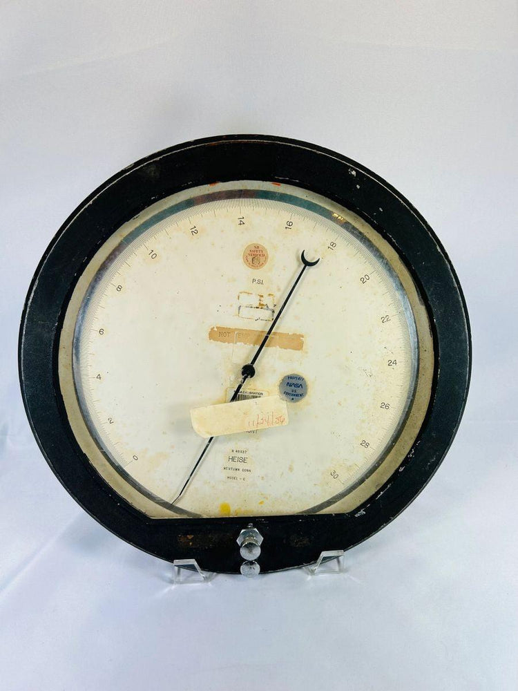 Authentic NASA low-pressure gauge from the Space Shuttle Program, mid-1980s. Manufactured by Heise in Newtown, Connecticut, marked “Property of NASA U.S. Government,” with original calibration and service stickers. Ground support equipment used for monitoring hydraulic, fuel, or environmental pressures during shuttle pre-launch operations.