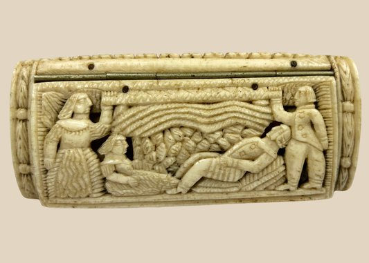 Napoleonic prisoner-of-war carved bone snuff box showing a narrative scene with multiple human figures in relief on a beige background.