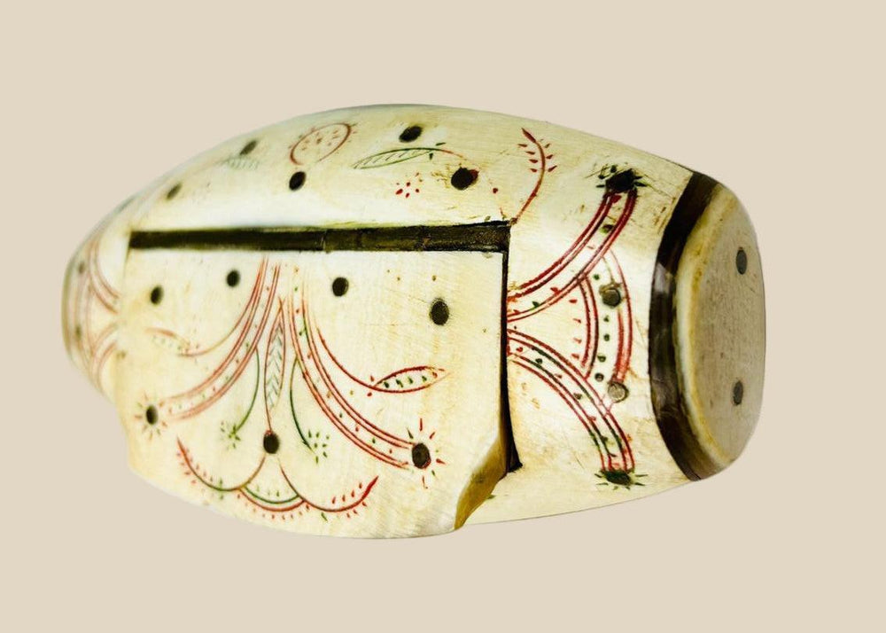 Antique Napoleonic prisoner-of-war snuff box, carved bone with red and green ink floral designs, domed lid, circa 1793–1815.