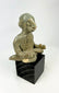 West Mexican Chinesco seated male figure with traces of red pigment and burial patina