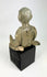 Pre-Columbian Nayarit seated male sculpture with crossed legs and stylized features