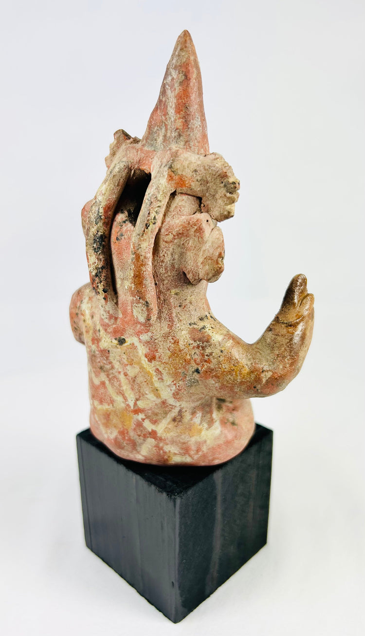 Pre-Columbian Nayarit seated figure with raised arm holding ritual object