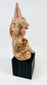 Museum display of a West Mexican Nayarit cone-cap ceramic figure