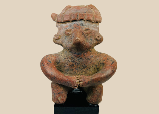 Ancient Nayarit terracotta seated figure from West Mexico Shaft Tomb tradition on a black museum stand