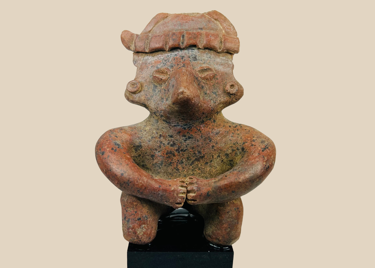 Ancient Nayarit terracotta seated figure from West Mexico Shaft Tomb tradition on a black museum stand