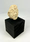 Near Eastern Mesopotamian carved stone head, early votive idol fragment with broad nose and stylized eyes