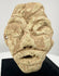 Near Eastern limestone idol head with stylized facial features, possibly dating to the 2nd–1st millennium BCE.