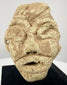 Near Eastern limestone idol head with stylized facial features, possibly dating to the 2nd–1st millennium BCE.