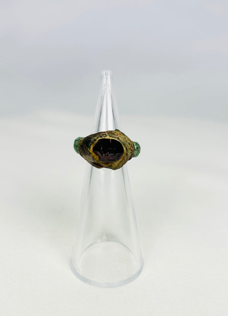 Ancient Assyrian bronze ring with garnet intaglio from 9th–7th century BCE