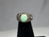 Mesopotamian silver ring depicting winged serpent and mythical creatures on silver band