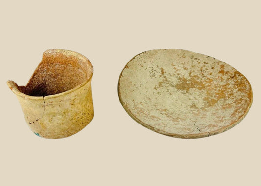 Set of Neolithic terracotta pottery, including a shallow bowl and cylindrical vessel fragment, circa 4000–2000 BCE, with natural earthy tones, unglazed surfaces, and aged patina.