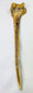 Side profile of New Guinea human humerus dagger showing elongated tapered form and preserved bone structure