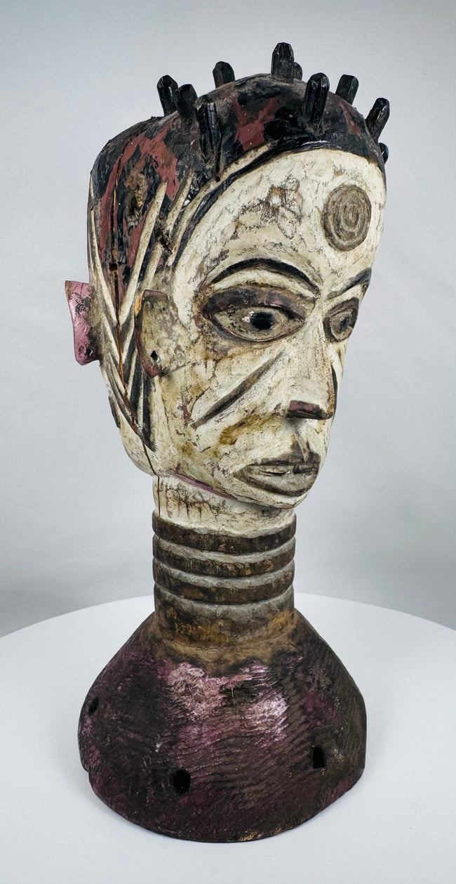 Hand-carved Igbo ceremonial masquerade headdress with dual-faced Janus design and original pigment decoration.
