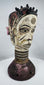 Hand-carved Igbo ceremonial masquerade headdress with dual-faced Janus design and original pigment decoration.