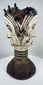 Traditional Igbo masquerade crest with opposing faces, projecting coiffure elements, and aged patina.