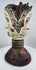 Mid-20th century Nigerian dance crest displaying two opposing human faces and traditional masquerade artistry.