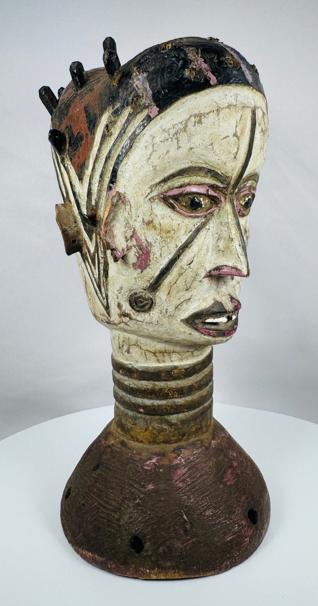 Hand-carved wooden Janus dance crest from Nigeria showcasing ritual symbolism and painted geometric motifs.