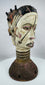Hand-carved wooden Janus dance crest from Nigeria showcasing ritual symbolism and painted geometric motifs.