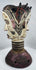Mid-century Igbo masquerade headdress featuring a carved Janus head design and weathered surface patina.