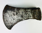 19th-century frontier-era hand-forged iron axe head showing tapered cutting edge and aged patina