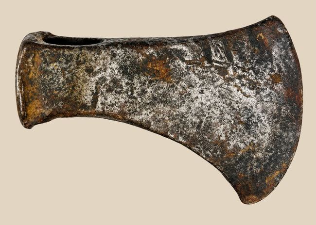 Antique 19th-century North American axe head, hand-forged iron with weathered patina and signs of historic use.