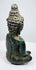 Rear three-quarter view showing the Buddha’s curled hair and rounded ushnisha