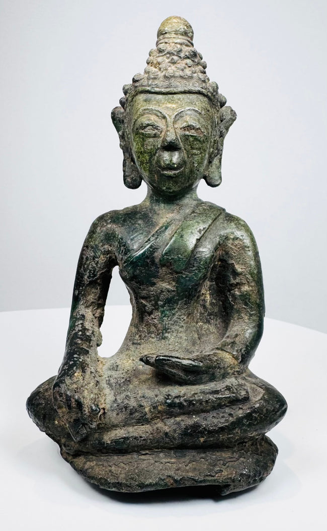 Front view of a Lan Na bronze Buddha seated in the earth-touching gesture